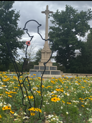 outline of soldier in front of the war memorial