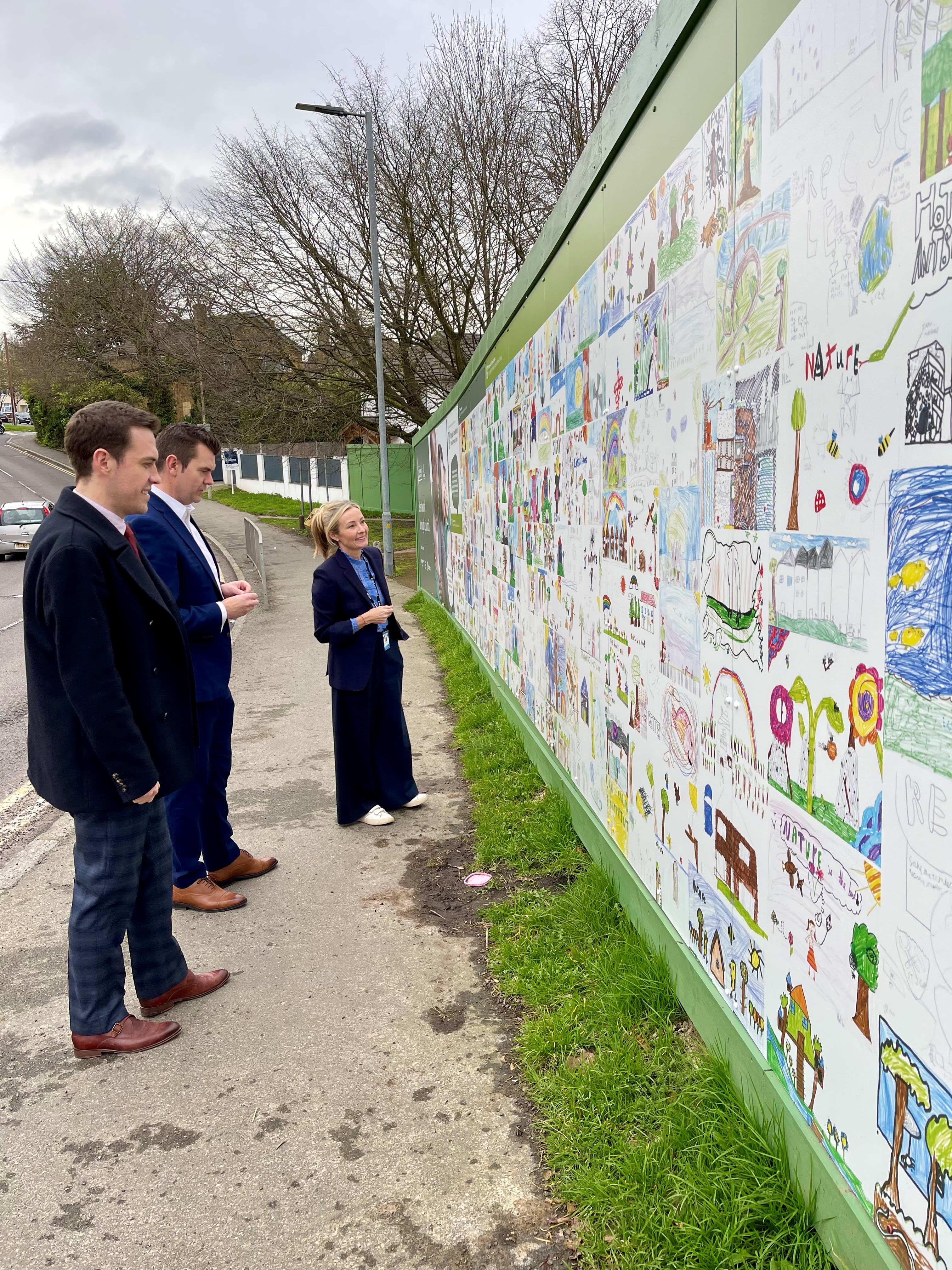 Brentwood Borough Council's Cllr Dr Tim Barrett; Jonathan Stephenson and Paulette McAllister seeing school pupils artwork at Brookfield Close