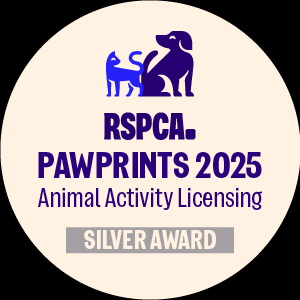 RSPCA 2025 Pawprints Silver Award logo with a cat and dog silhouette.